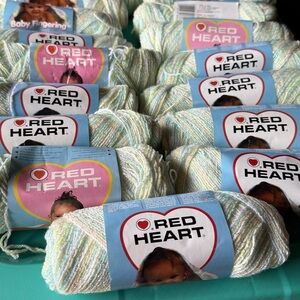 Red heart Baby yarn bundle of 17 skeins 42g each in a rainbow sparkle.